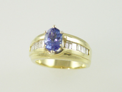 14KT Y/G Center Oval Tanzanite 1.43ct Baguette Diamonds 0.75ct Ring
