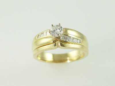 14KT Y/G Diamond Baguette 0.28ct., One Round Diamond 0.42ct Ring