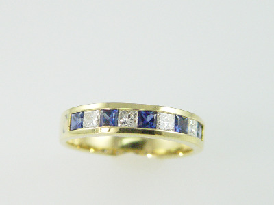 18KT Y/G Channel Set Princess Cut Diamonds 0.55ct Sapphire 0.95ct Band