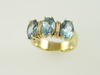 14KT Y/G three Stone Oval Blue Topez 4.18ct Band