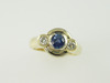 14KT White/Yellow Gold Bezel Set Sapphire 0.68ct Two Diamonds 0.28ct