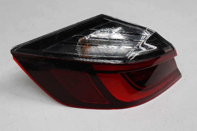 Blemished Multiple items in stock; exact location and size of lens chip will vary, but will be as described. Will not leak or collect moisture. Trunk trim is NOT included (though pictured); must swap trunk trim off your old lamp. Left (driver) side lamp, quarter panel mounted, LED type. Lens surface has marks, scratches. May have other minor imperfections. Please match part numbers before purchasing.** ### Photos ![