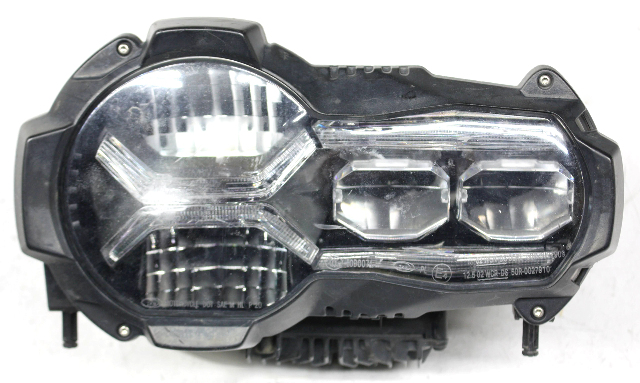 Blemished Inner chrome and inner lens surface has factory flaws. FITMENT NOTES: Headlamp, LED type. Comes as shown. ONLY for R1250 GS models. Lens surface may have marks. May have other minor imperfections. It may have marks from storage and handling but overall in excellent working condition. Please match part numbers before purchasing.** ### Photos ![