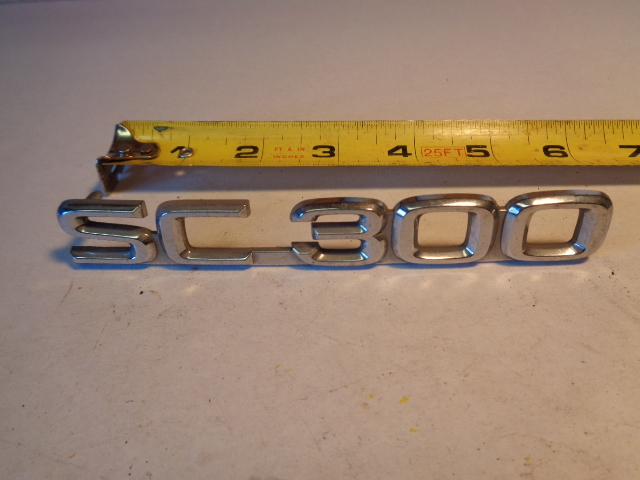 Lexus SC300 emblem, rear SC 300