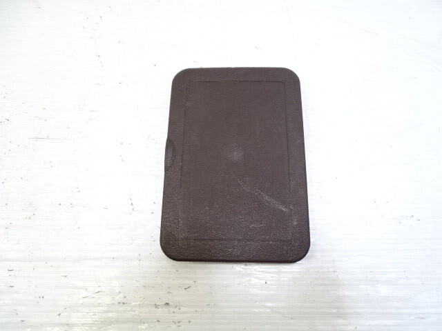 85 Mercedes R107 380SL trim, fuse box cover, brown, passenger footwell