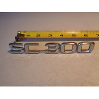 Lexus SC300 emblem, rear SC 300