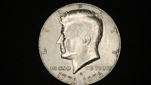 1976-D Kennedy Half Dollar 50c - Strike through grease error reverse
