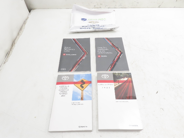 23 Toyota Corolla Cross #1332 Owner's Manual Set, Books & Pouch